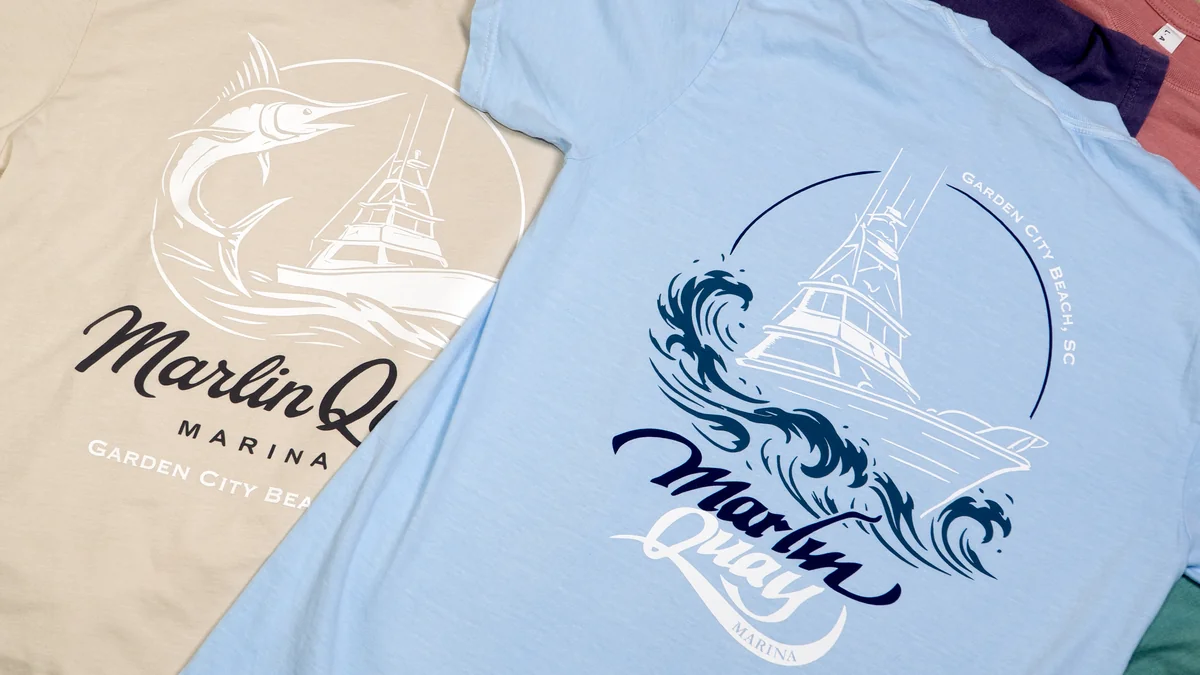 Marlin Quay merchandise arranged together, including blue printed garments.